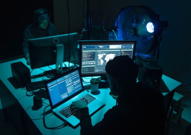 man at desk with computer